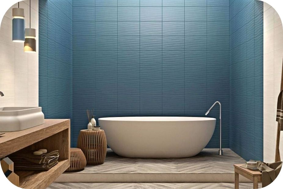 Kupatilo sa plavim reljefnim pločicama i samostojećom kadom