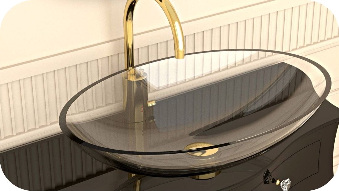 Stakleni umivaonik sa zlatnom slavinom